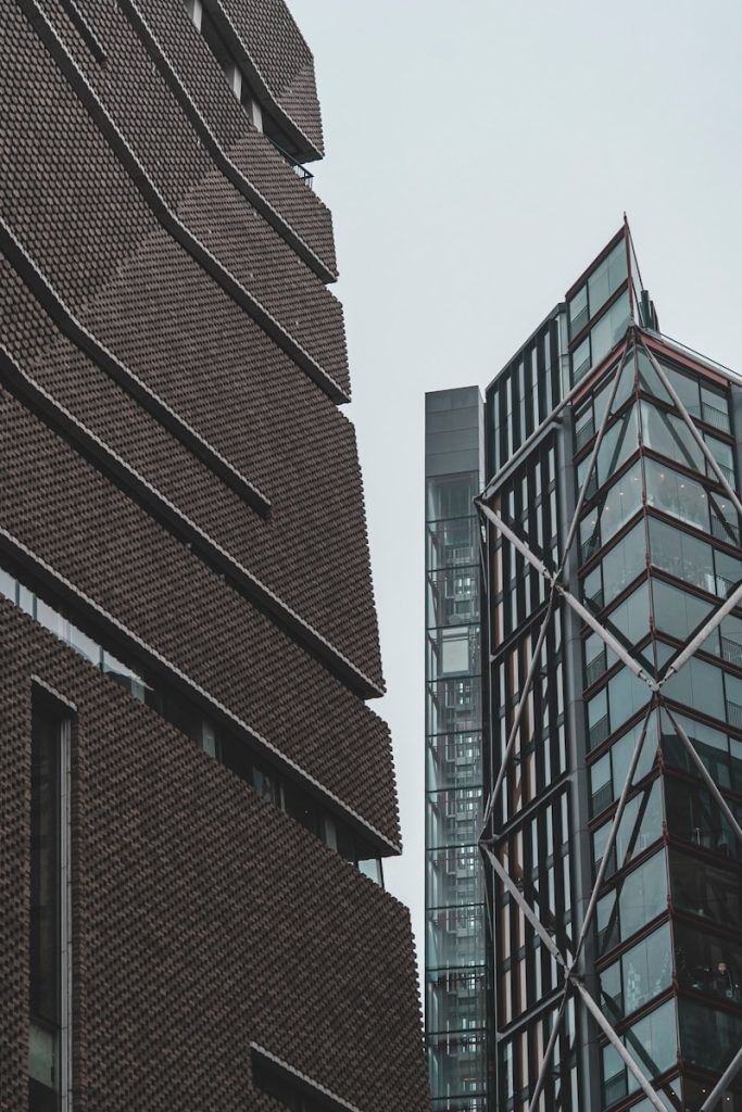 a tall building next to a very tall building